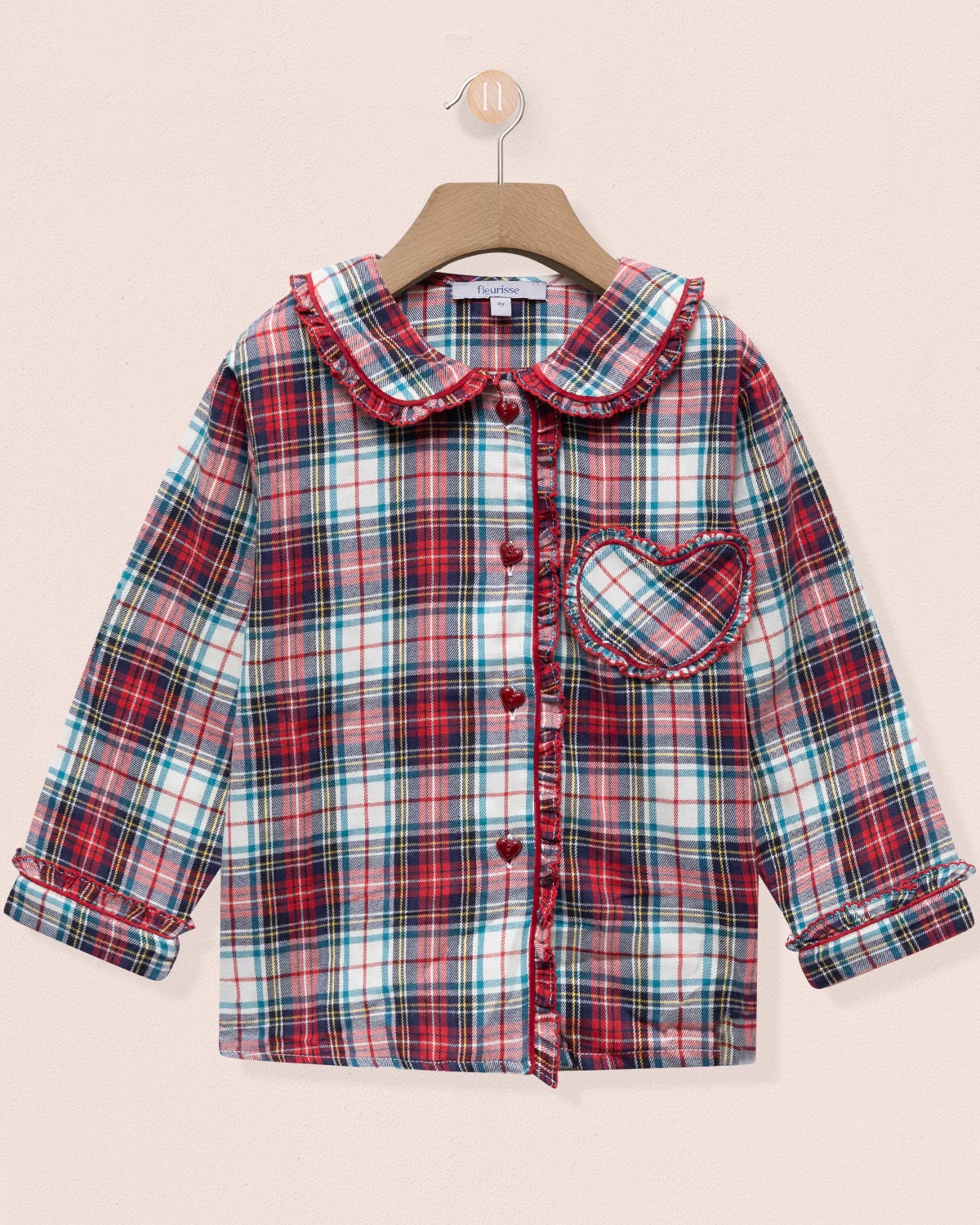 Plaid shirt with a collar on a beige background