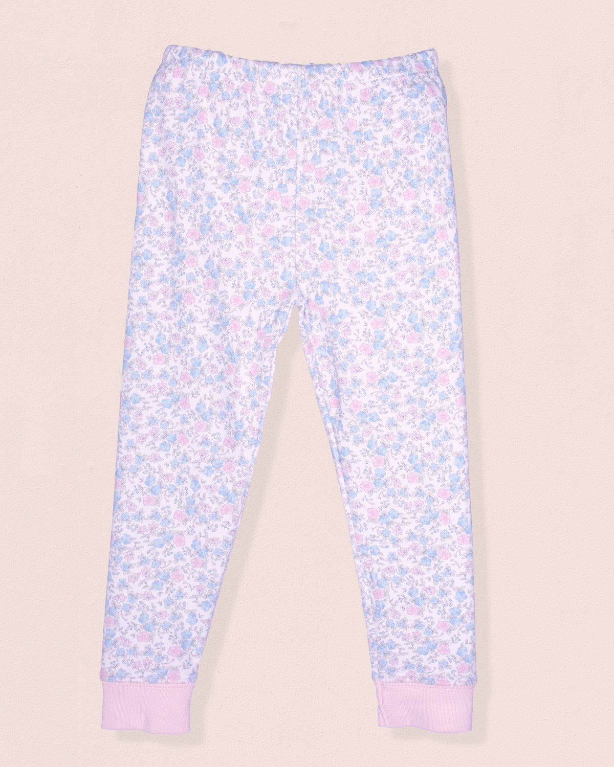 Floral-patterned leggings on a beige background