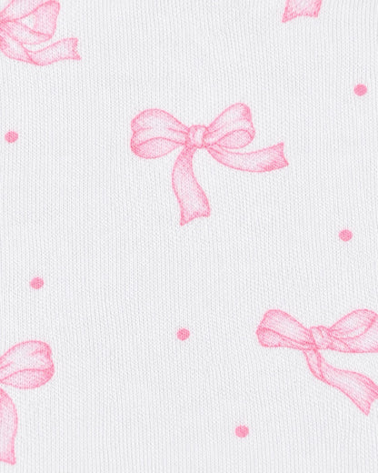 White textured fabric with a repeating pattern of light pink bows and small pink polka dots.