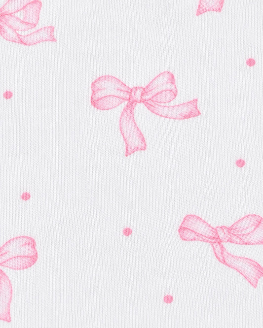 White textured fabric with a repeating pattern of light pink bows and small pink polka dots.
