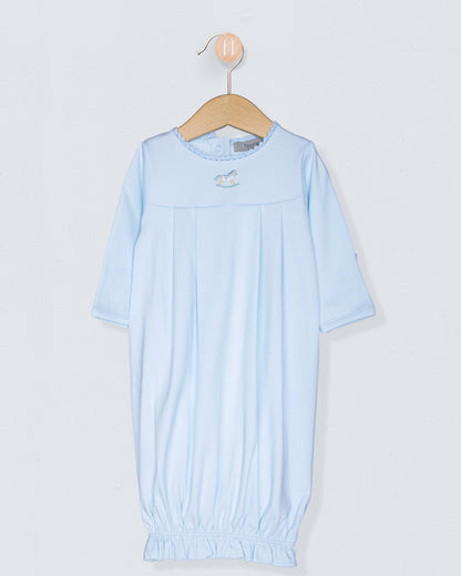 Light blue baby gown on a hanger against a light gray background