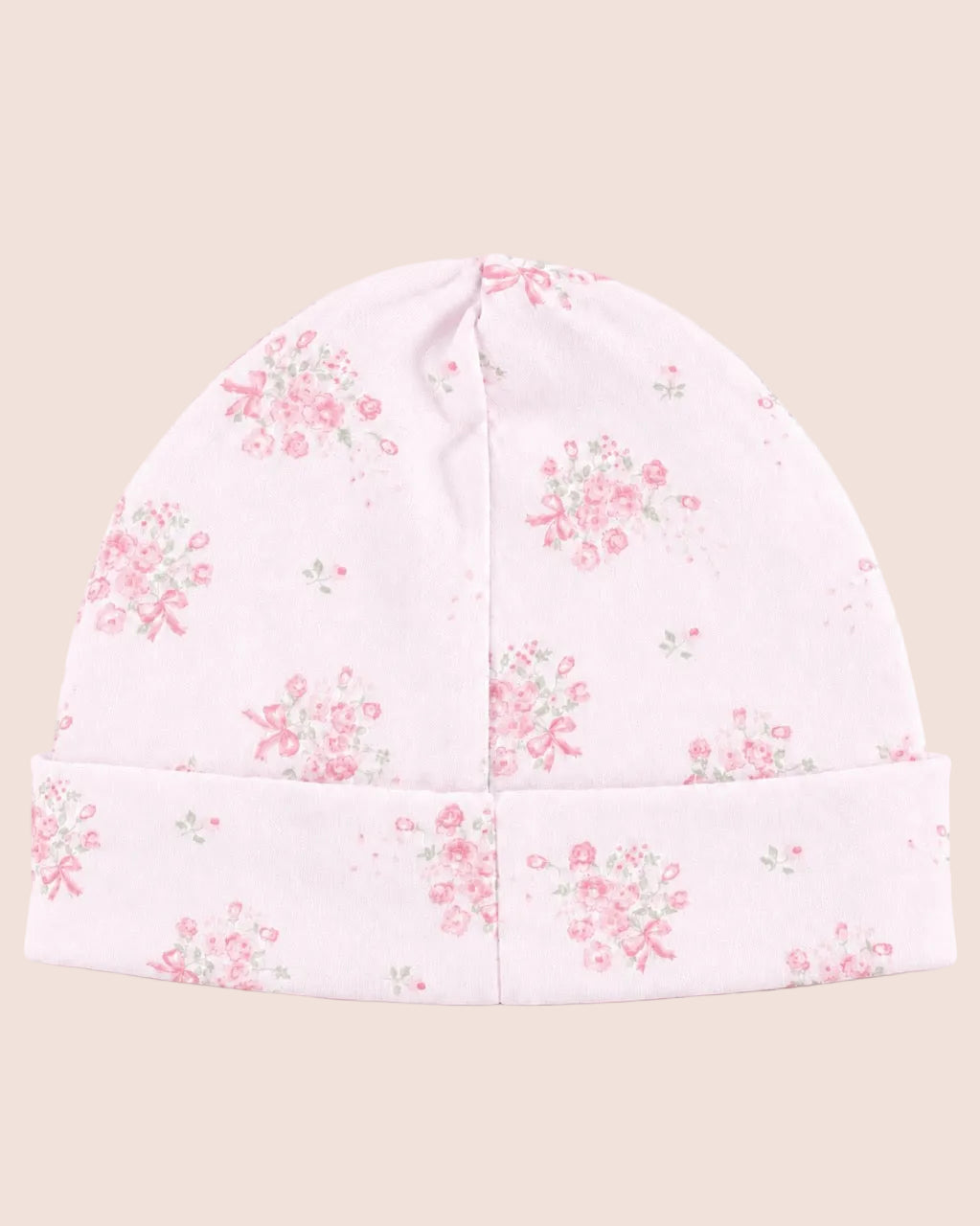 A light pink knit beanie hat with a delicate pink and green floral pattern, featuring a folded cuff, shown against a solid pale pink background.