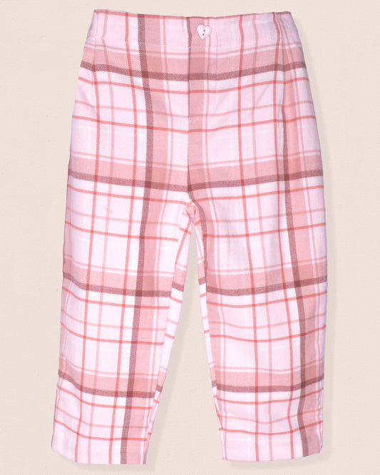 Pink plaid pants on a beige background