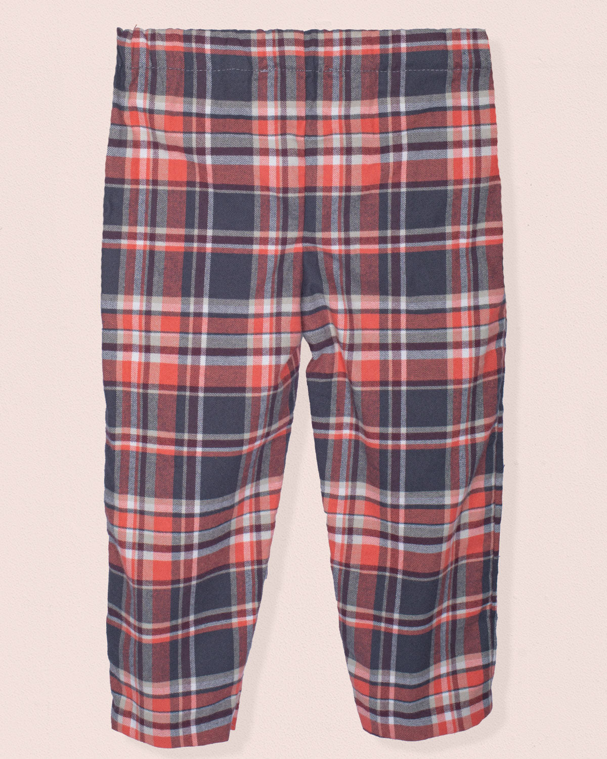 Back of plaid pants with red, brown, and gray pattern on a light pink background