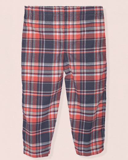 Back of plaid pants with red, brown, and gray pattern on a light pink background
