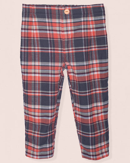 Front of pants with red, deep brown, and white pattern on a light pink background