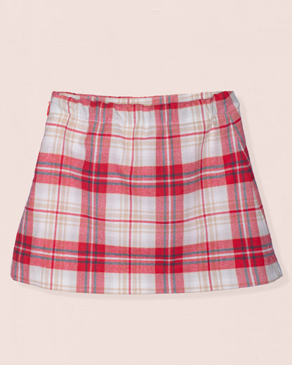Plaid skirt with red, white, and blue pattern on a beige background