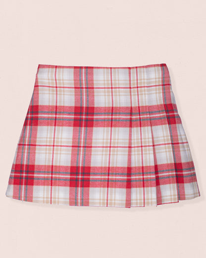 Front of plaid skirt with red, white, and blue pattern on a light pink background