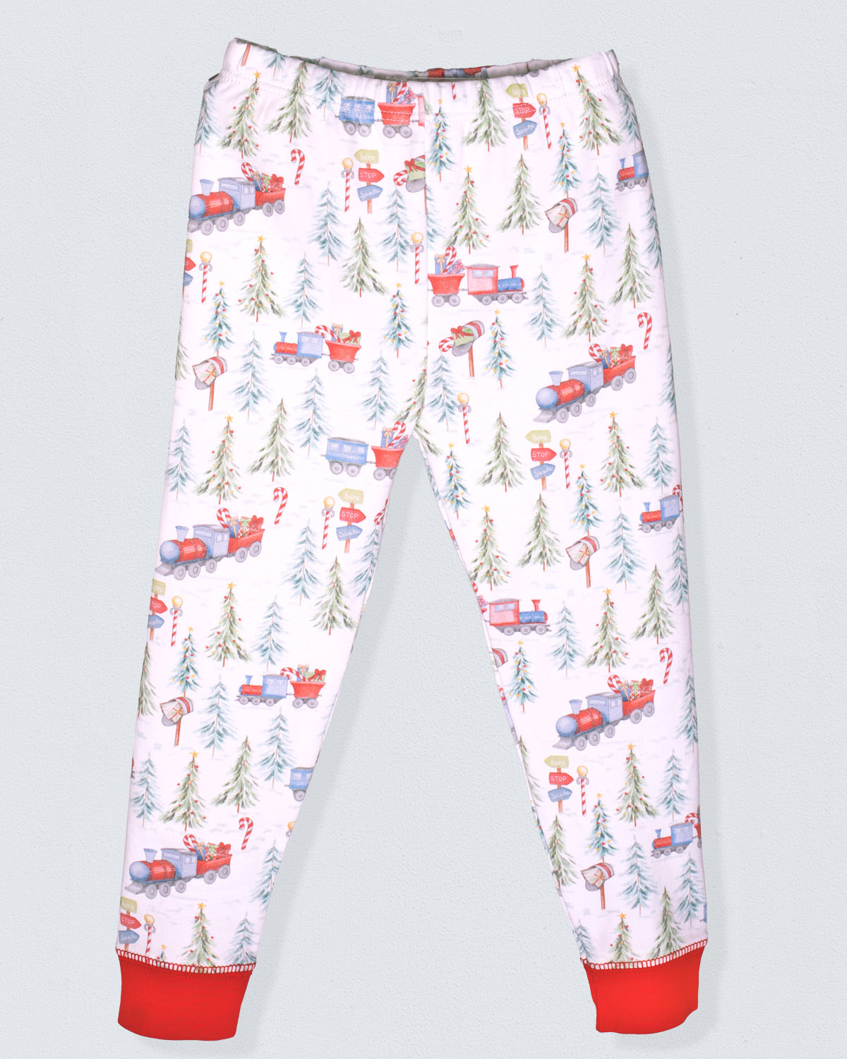 Children's pajama pants with Christmas tree and train pattern on a light gray background