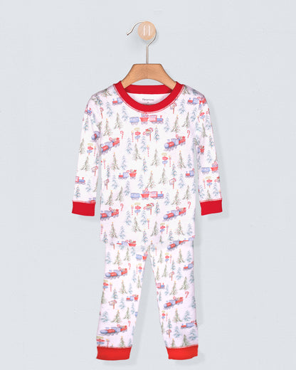 Children's pajama set with vehicle pattern on a hanger against a light gray background
