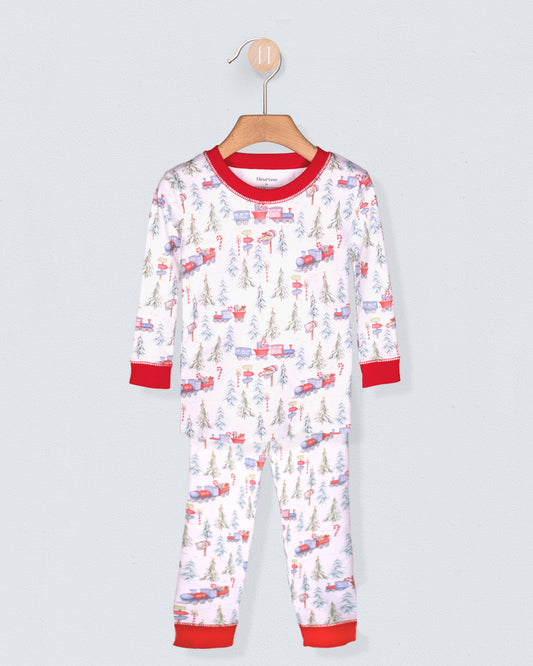 Children's pajama set with vehicle pattern on a hanger against a light gray background