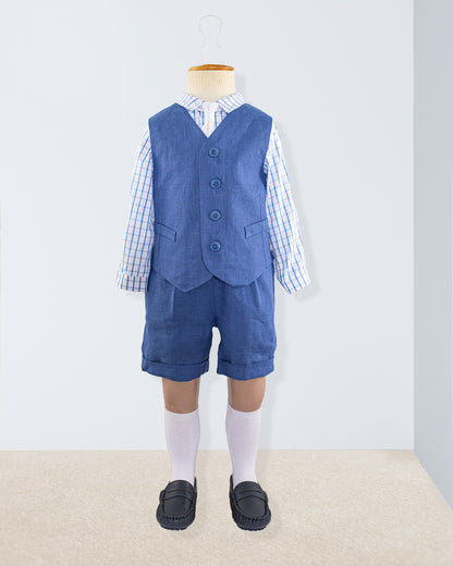 Prince Harry linen suspender shorts and vest styled over a plaid dress shirt, shown on a child-sized mannequin with knee socks and loafers