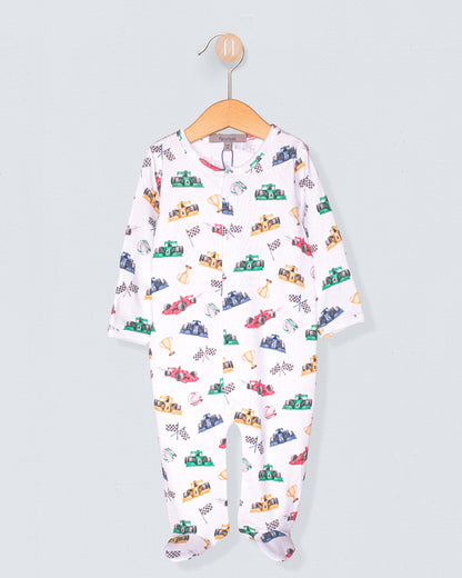 Baby onesie with car pattern on a hanger against a light gray background