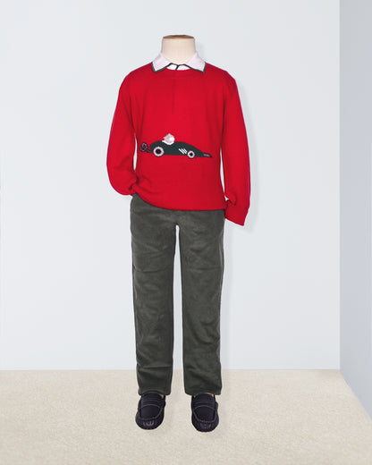 Red sweater with a car design on a mannequin against a white background