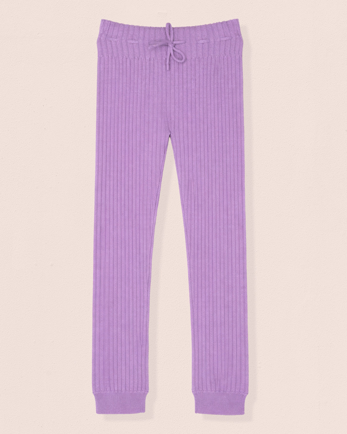 Purple ribbed pajama pants on a beige background