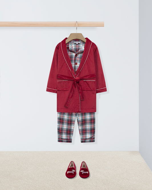 Red robe with plaid shirt and pants on a hanger, accompanied by red shoes on a white background.