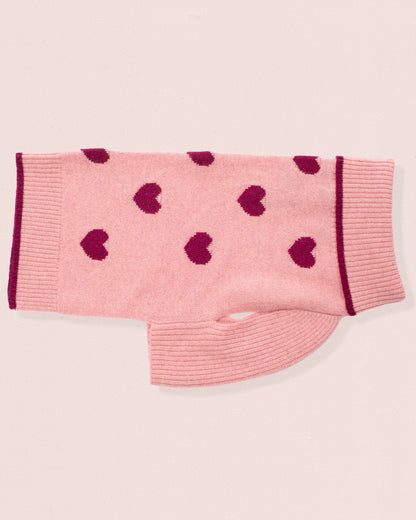 Cashmere sweater for dogs, with dark pink heart patterns on a light pink background