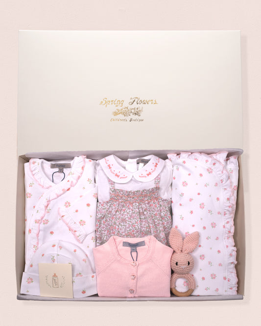 Baby clothing set with floral patterns in a gift box, featuring a footie, romper, blanket, cardigan