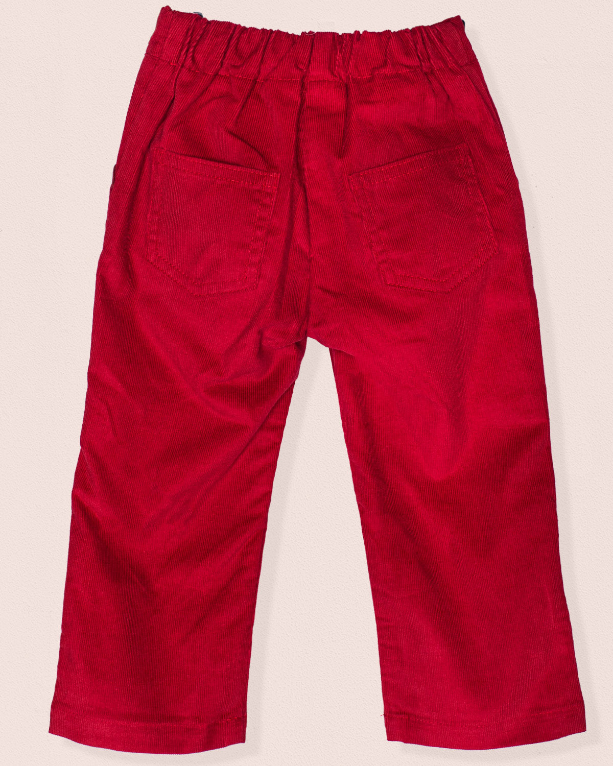 Back view of ruby burgundy Italian corduroy pull-on pants with elastic waistband and two square back pockets.