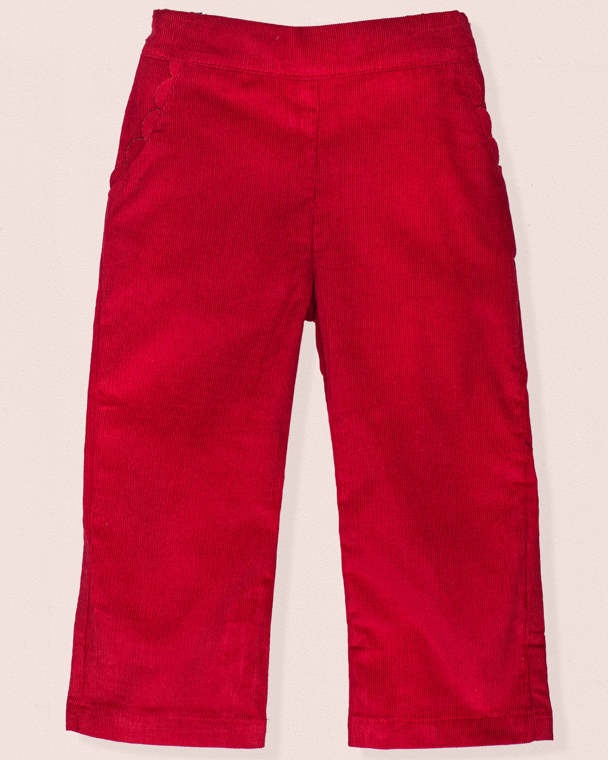 Front view of ruby burgundy Italian corduroy pull-on pants with scalloped front pocket detailing.