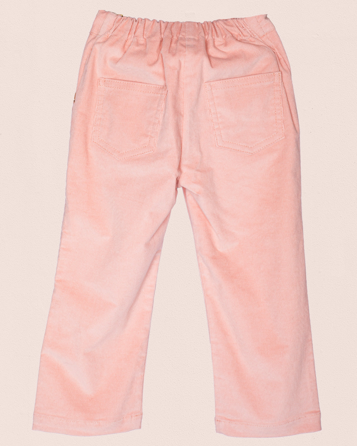 Back view of ruby pink Italian corduroy pull-on pants with elastic waistband and two square back 