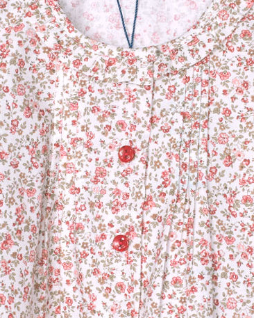 Floral patterned fabric with red flowers on a white background