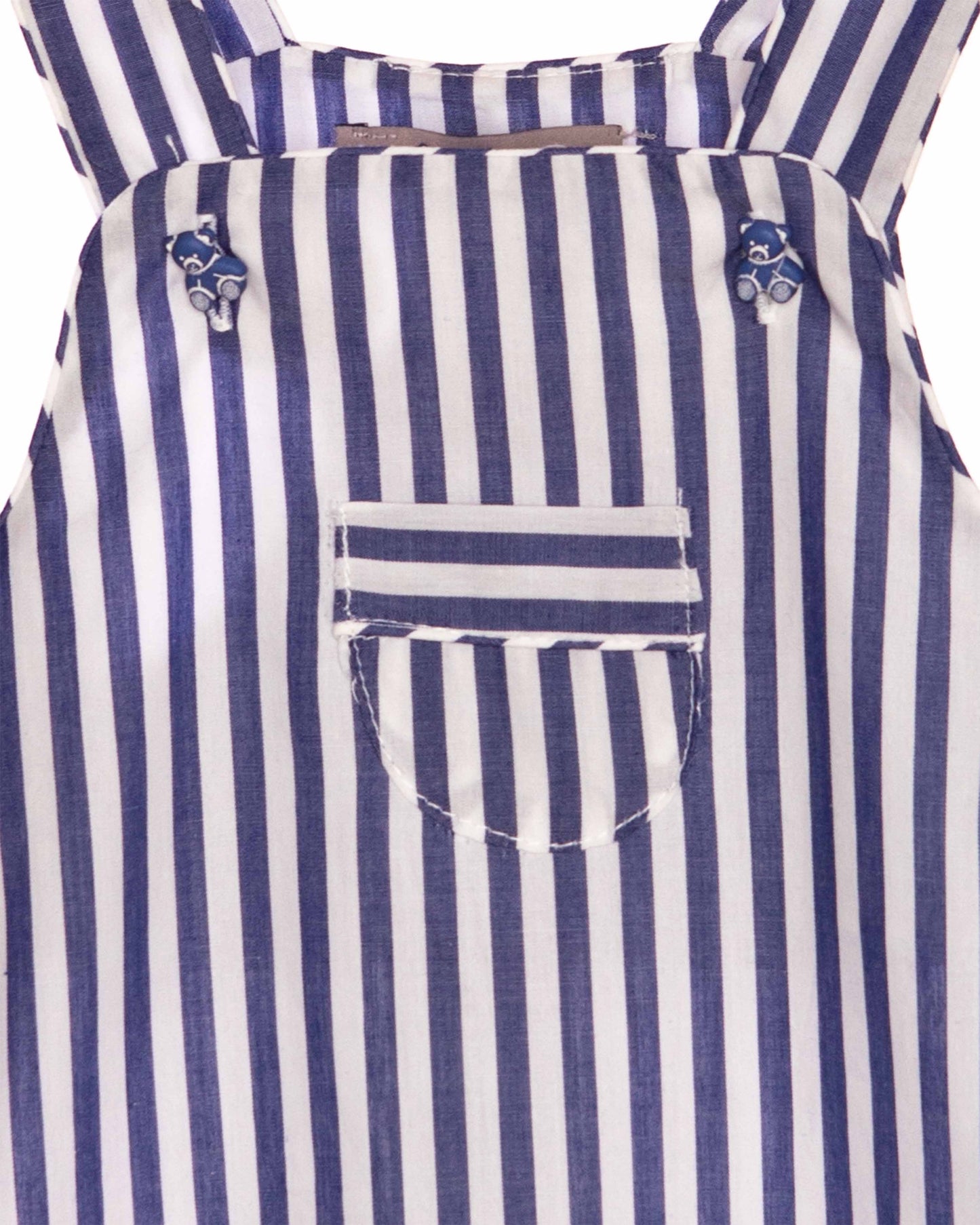Close up of fabric of Blue and white striped shortall with a pocket on a white background