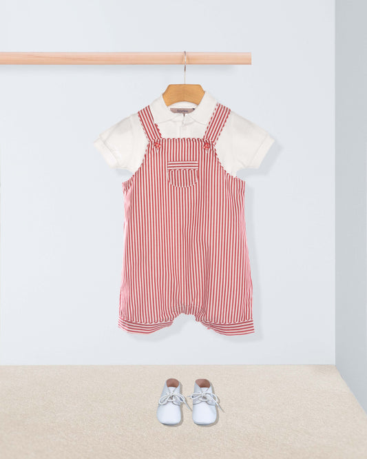 Red and white striped shortall with white shirt and shoes on a light gray background