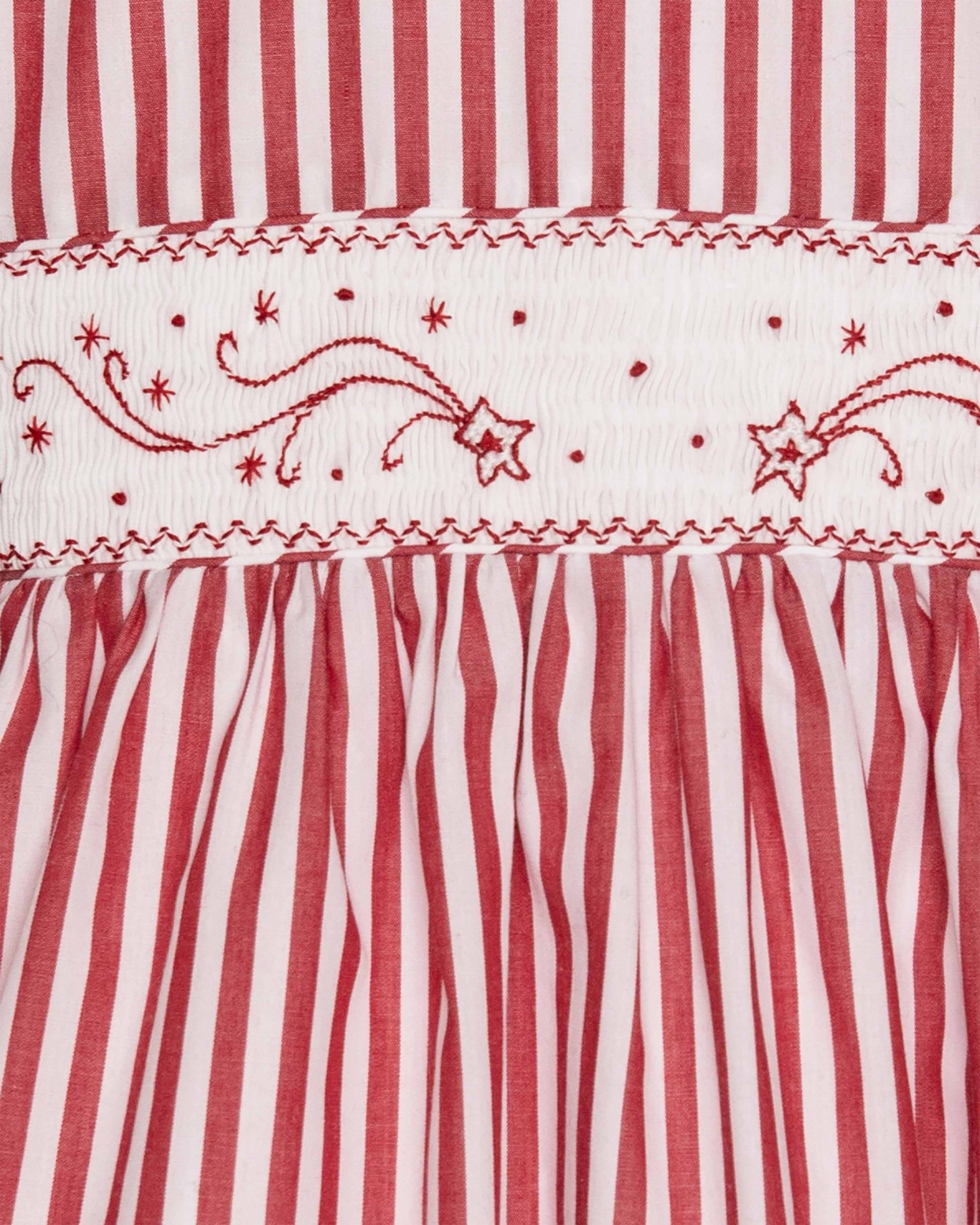 Red and white striped fabric with embroidered patterns