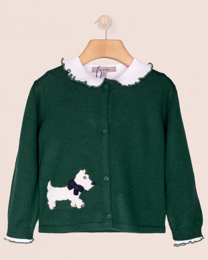 Green cardigan with white dog design on a beige background