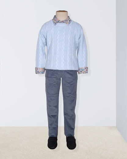 Mannequin wearing a light blue shirt with patterned collar and cuffs, paired with gray pants on a white background.