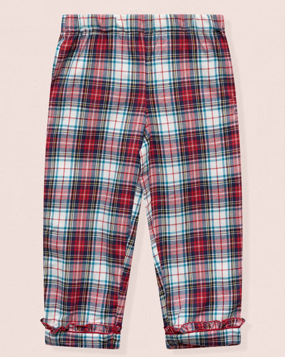 Plaid pants with red, blue, and white pattern on a light pink background
