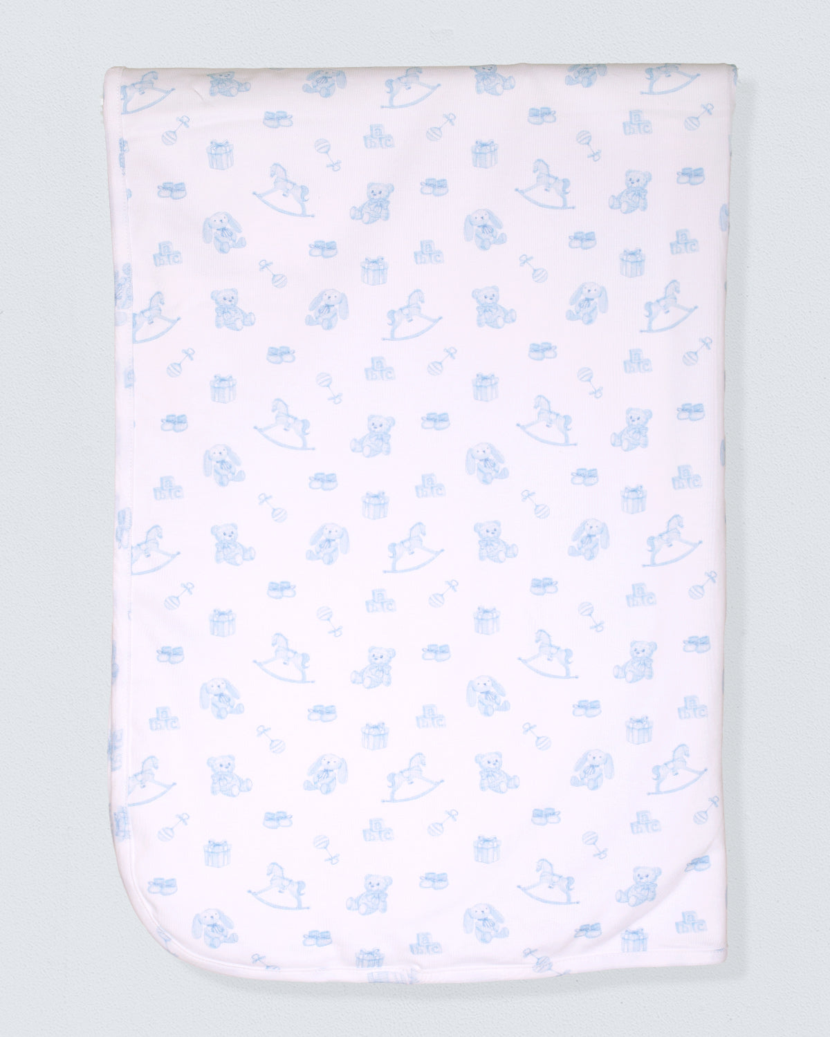 Baby blanket with blue teddy bear pattern on a light gray background