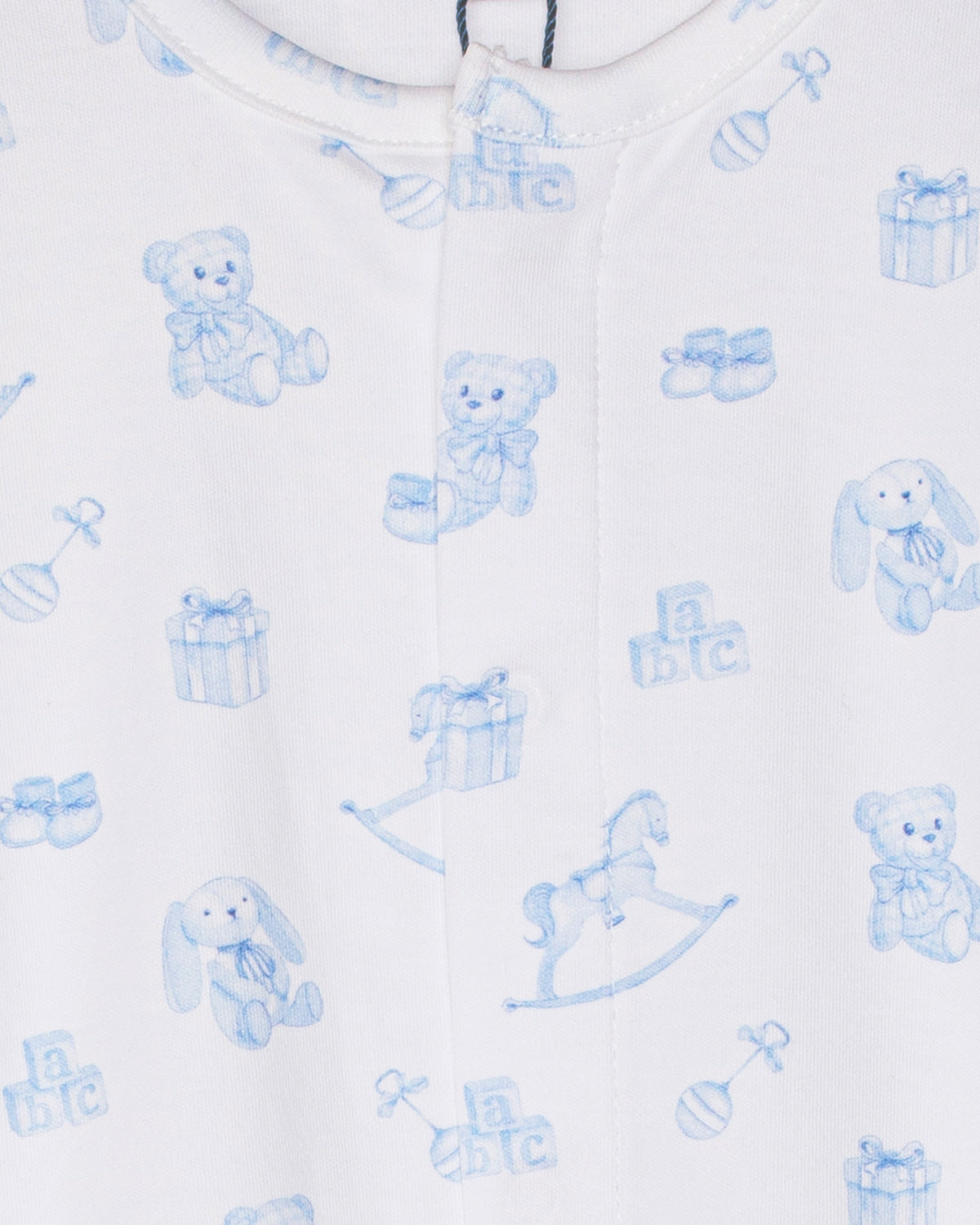 Baby onesie with blue teddy bear and rocking horse patterns on a white background