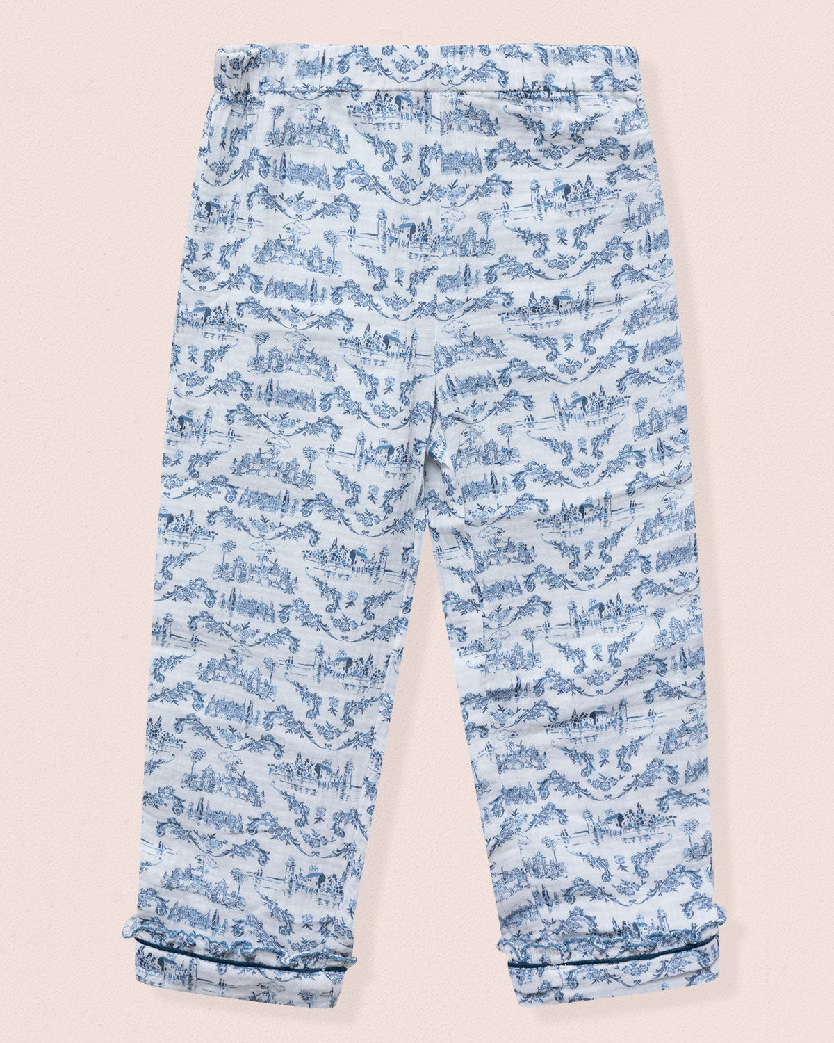Blue patterned pants on a beige background