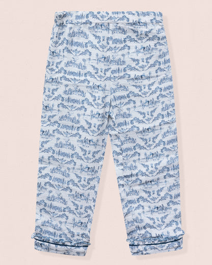 Blue patterned pants on a beige background