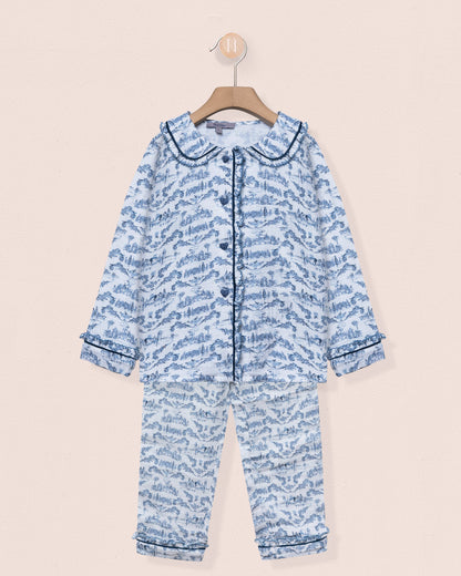 Blue patterned baby onesie on a beige background