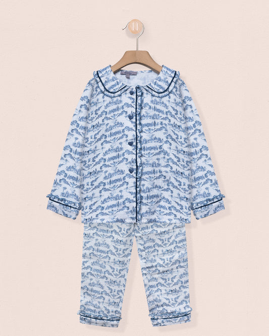 Blue patterned baby onesie on a beige background