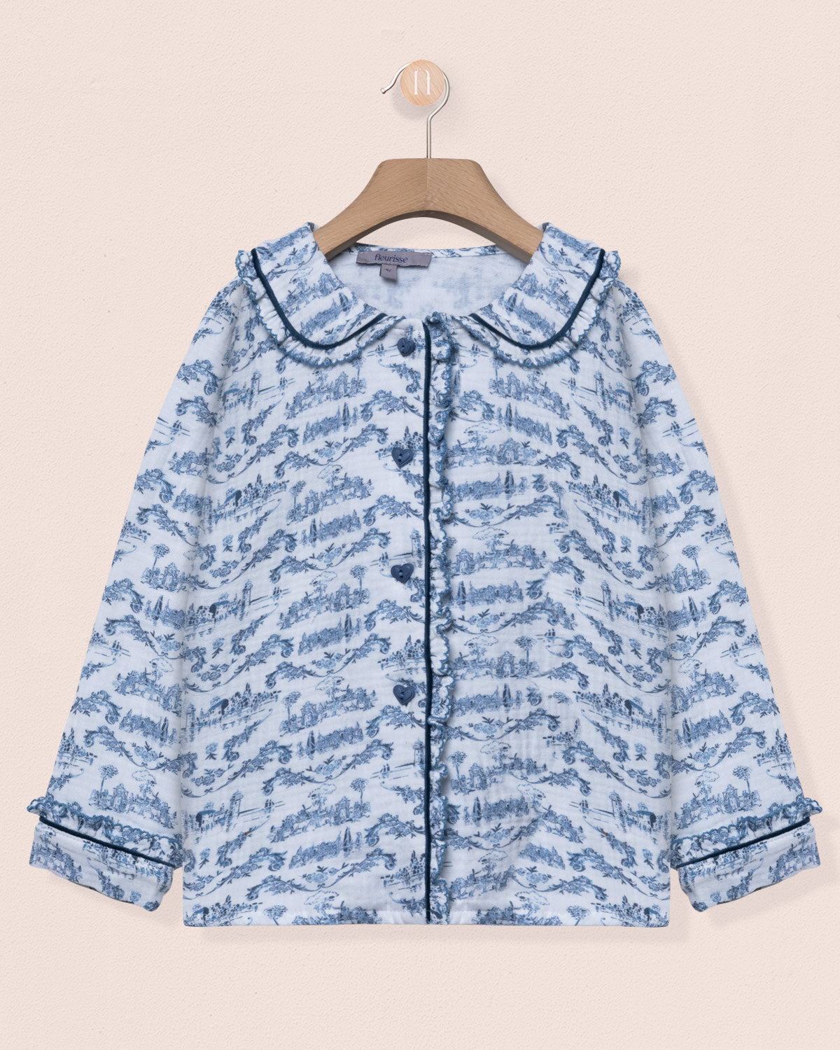 Blue patterned jacket on a beige background