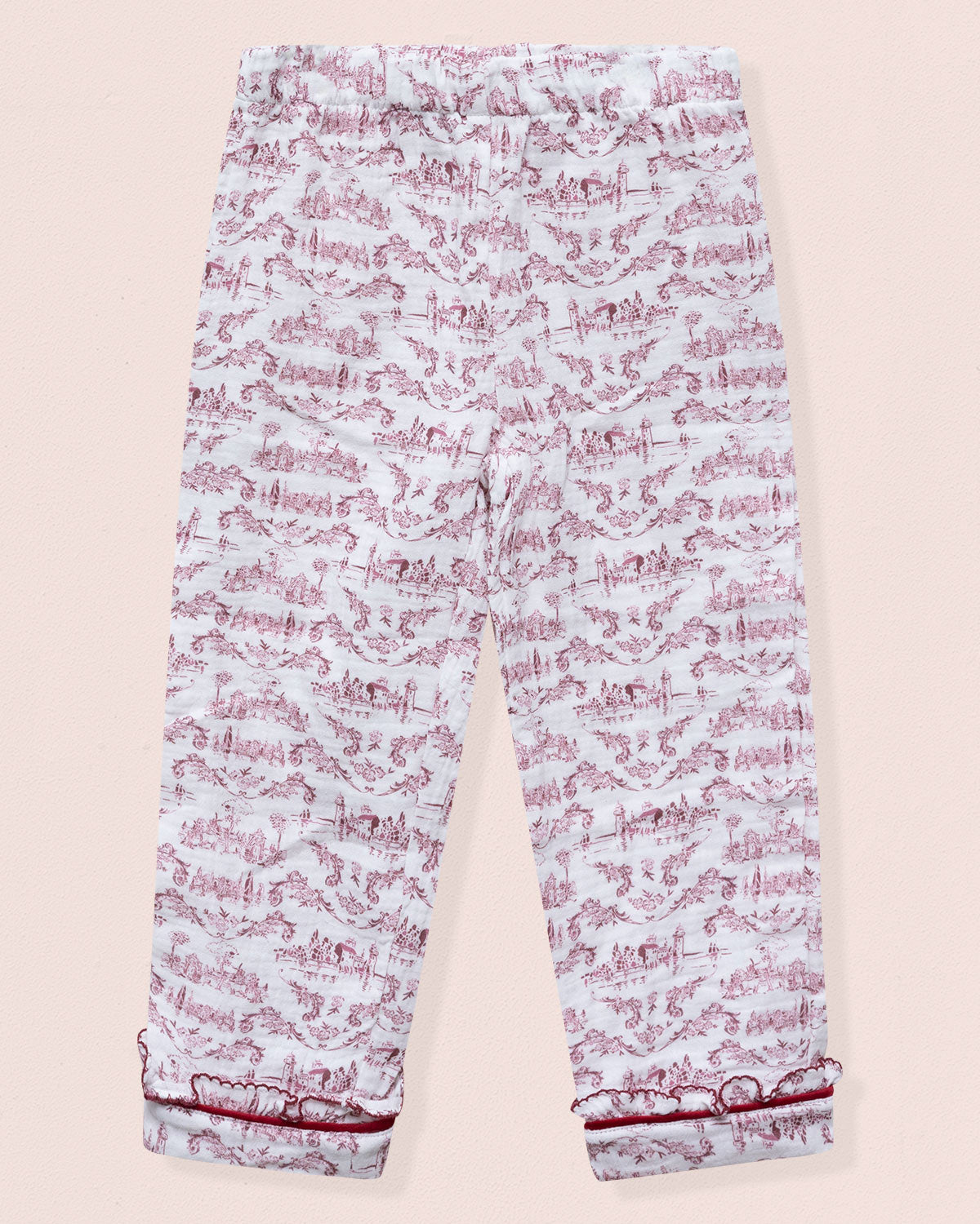 Light blue pants with pink floral pattern on a beige background