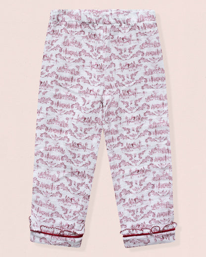 Light blue pants with pink floral pattern on a beige background