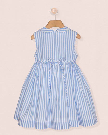 Blue and white striped dress on a beige background