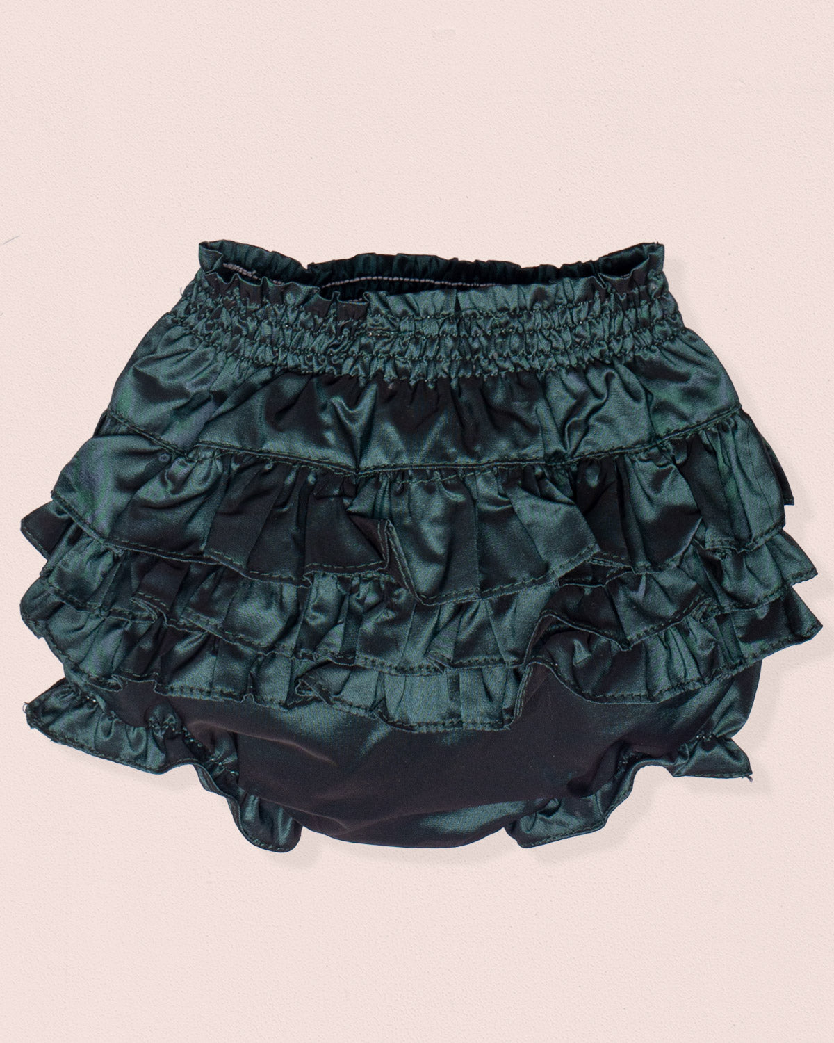 Green ruffled bloomers on a beige background
