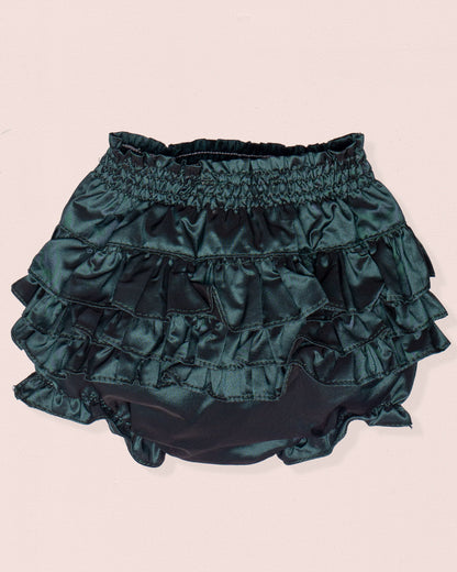 Green ruffled bloomers on a beige background