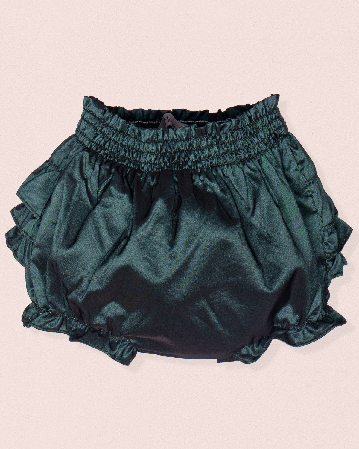 Green satin bloomers on a light pink background
