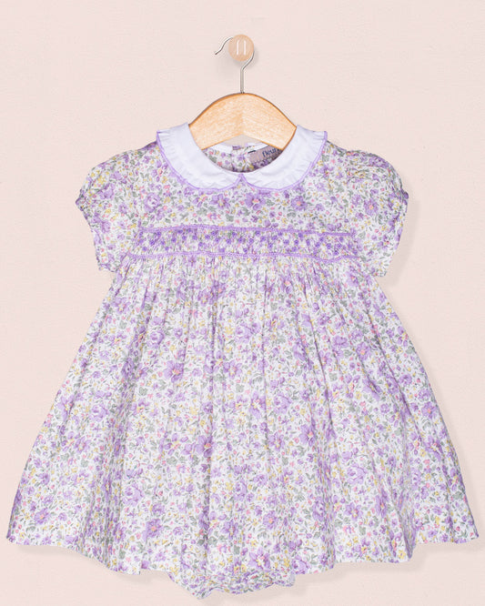 Floral dress with a white collar on a beige background
