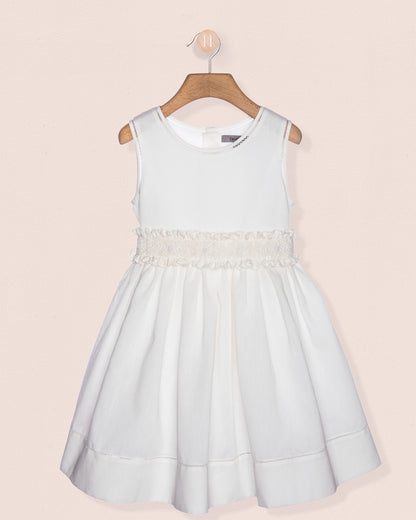 Light blue dress with lace details on a pink background