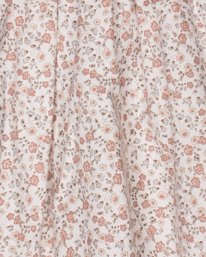 Close-up of the dress fabric, featuring a soft twill texture with a delicate French floral print in shades of pink, mauve, and green.