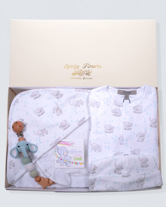 Baby gift set with white blanket, teether, and elephant toy in a box with 'Spring Flowers' branding.