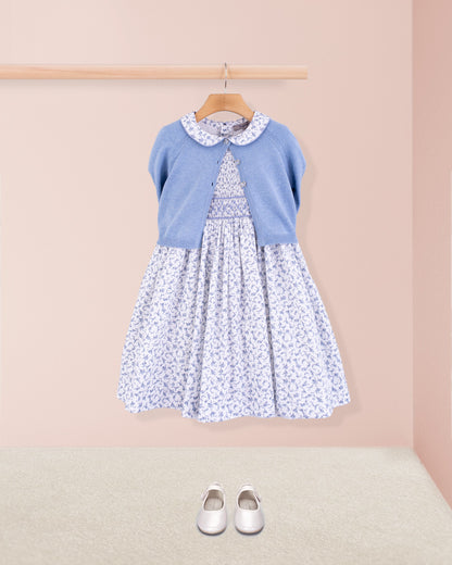 Amanda Campari dress styled with a blue melange cardigan, displayed on hanger